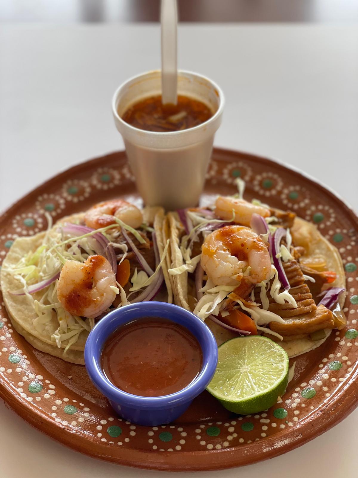 Taco plate with rice, beans, and salsas